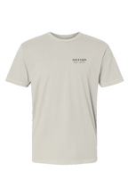 Light gray t-shirt with a small black logo on a white background